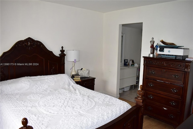 bedroom with light tile patterned floors