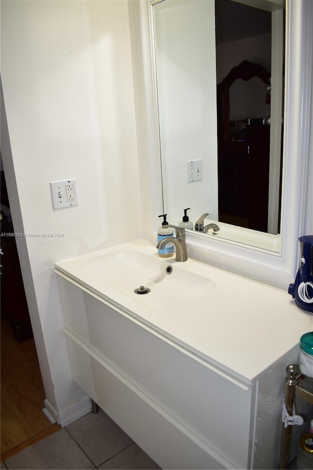 bathroom with tile patterned floors and vanity