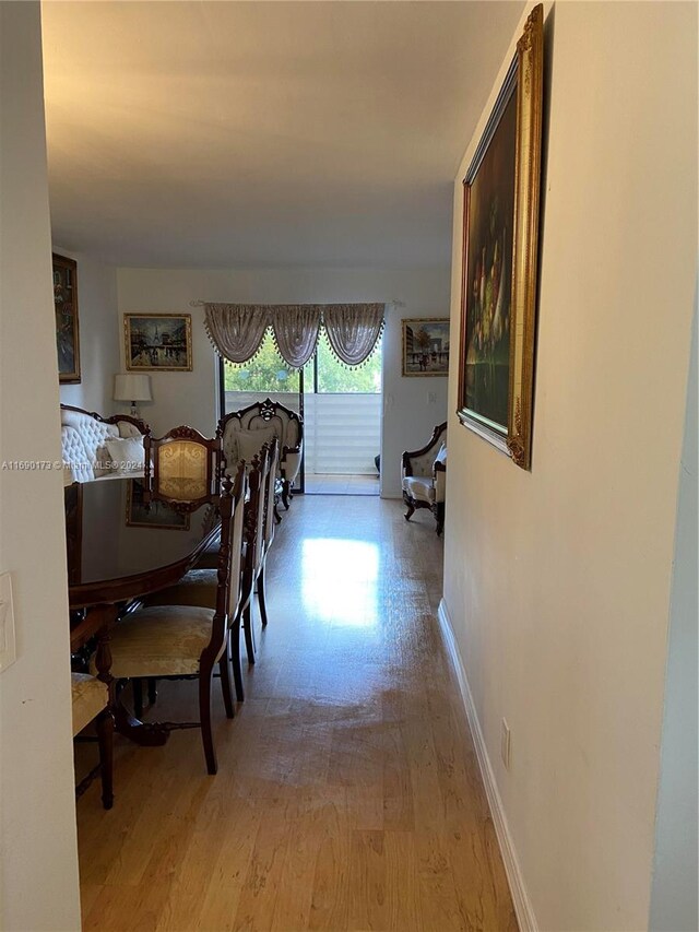 dining space with light hardwood / wood-style floors