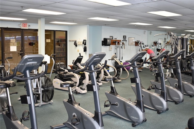 exercise room featuring a paneled ceiling