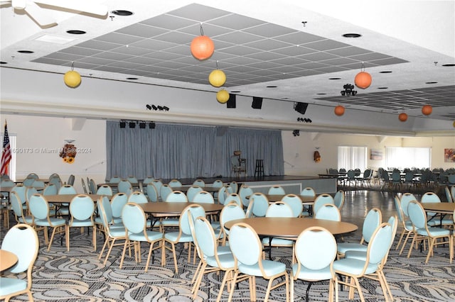 dining space with a drop ceiling