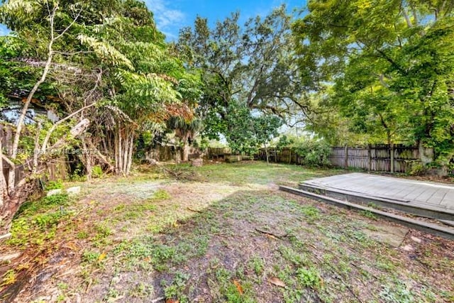 view of yard with a deck