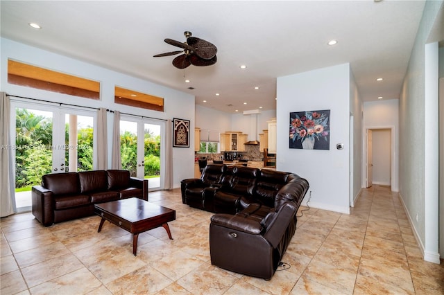 living room featuring ceiling fan and french doors