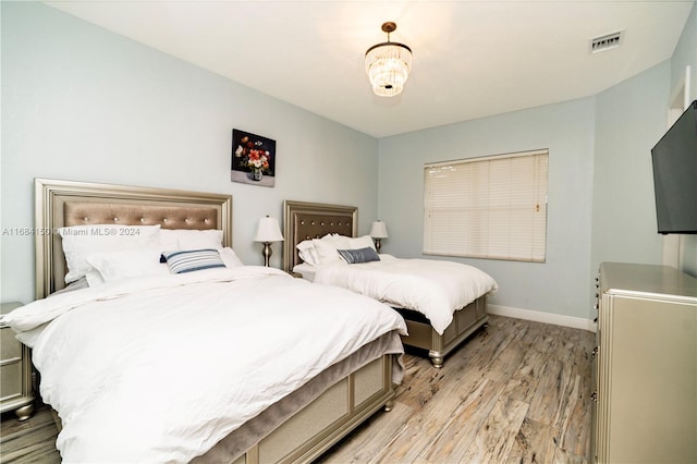 bedroom with light wood-type flooring