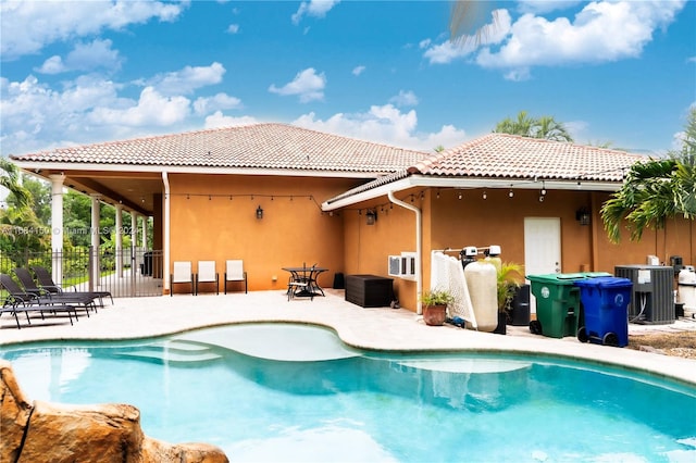 back of house with central AC unit and a patio area