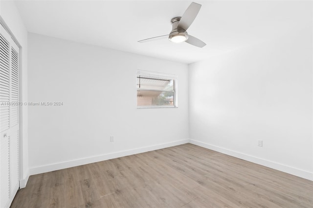 spare room with ceiling fan and light hardwood / wood-style flooring