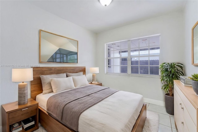 bedroom featuring light tile patterned flooring