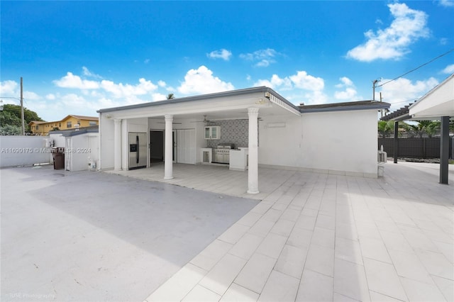 back of house with a patio area