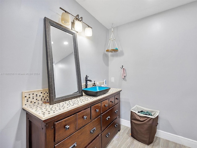 bathroom featuring vanity and wood-type flooring