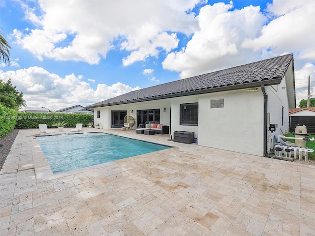 view of swimming pool with a patio area