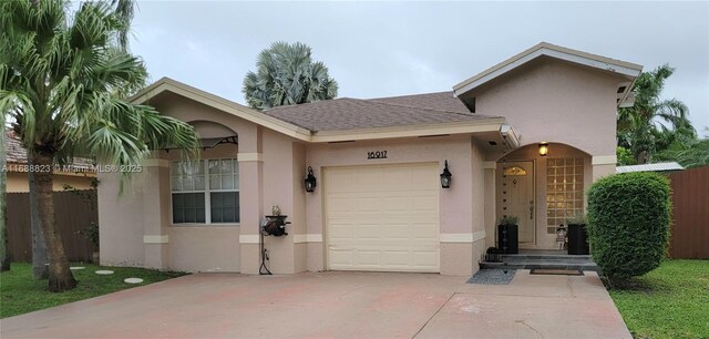 ranch-style house featuring a garage