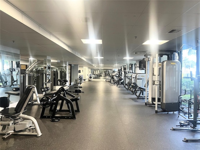 gym with a drop ceiling