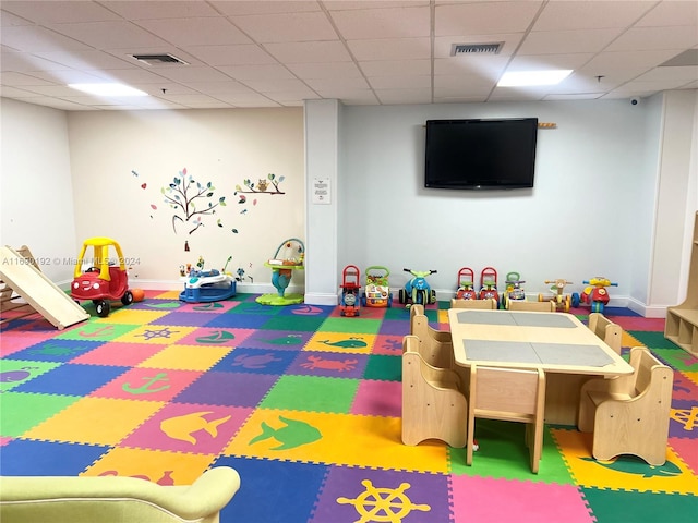 playroom with a drop ceiling