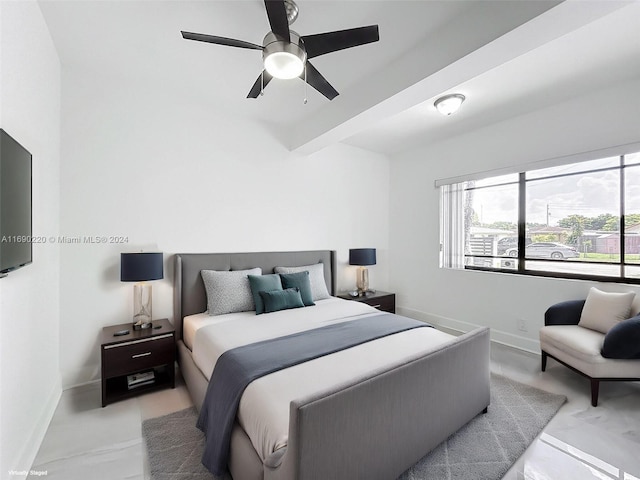 bedroom featuring beamed ceiling and ceiling fan