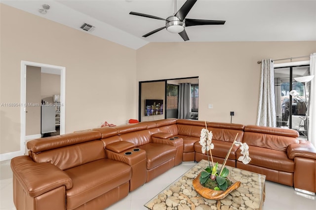 living room with light tile patterned flooring, ceiling fan, and lofted ceiling