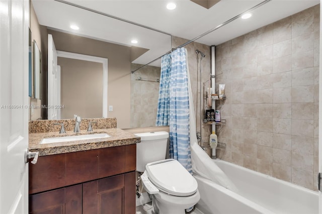 full bathroom featuring vanity, toilet, and shower / bathtub combination with curtain