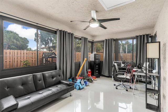 sunroom / solarium with ceiling fan