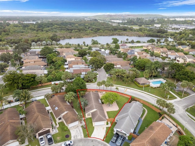 birds eye view of property featuring a water view