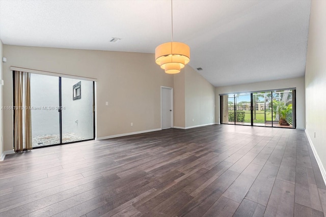 unfurnished room featuring high vaulted ceiling and dark wood-type flooring