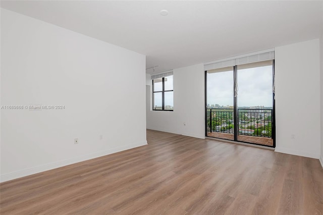 spare room featuring light wood-type flooring