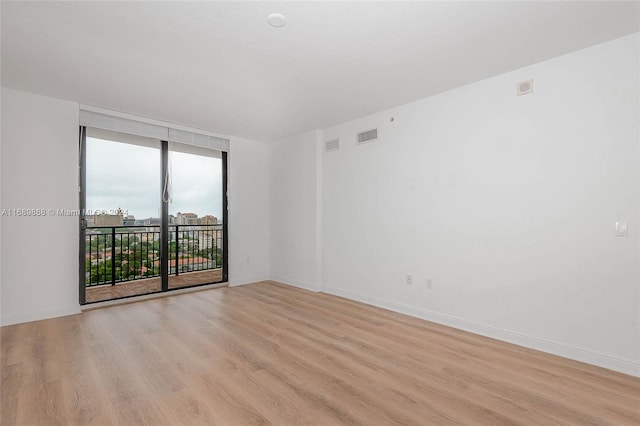 empty room with light wood-type flooring