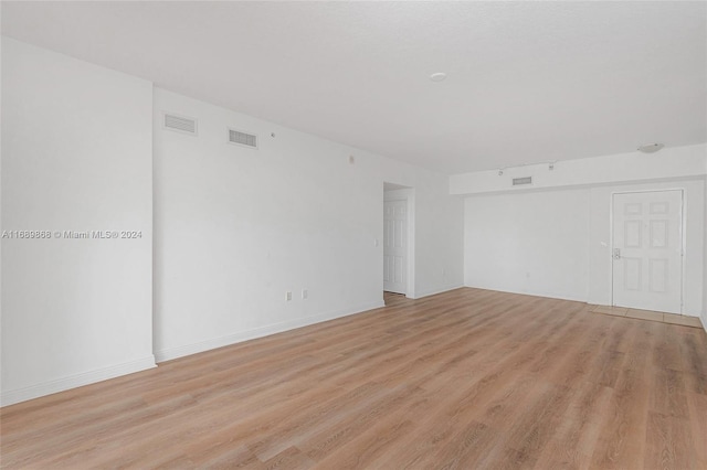 spare room with light wood-type flooring