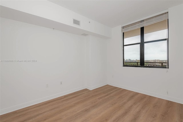 unfurnished room featuring light wood-type flooring