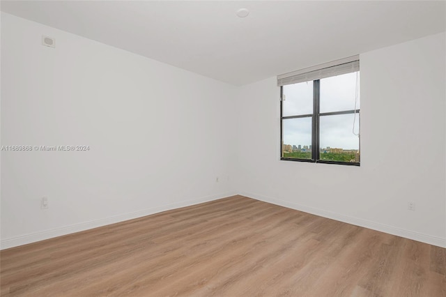 spare room with light wood-type flooring