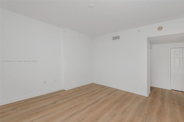 unfurnished room featuring light hardwood / wood-style floors