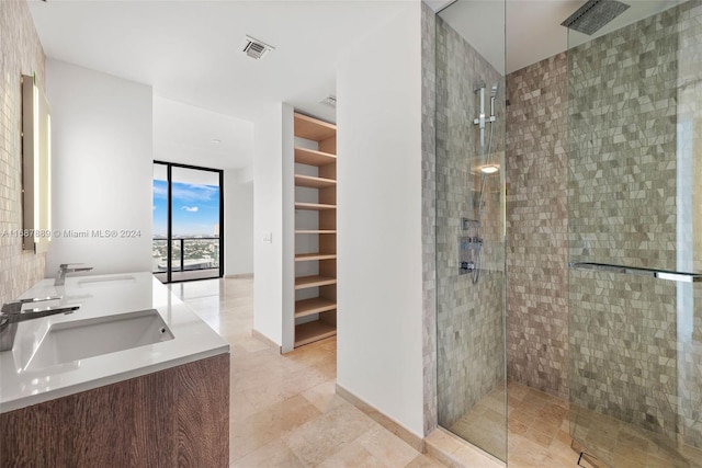 88 SW 7th St Unit 2408, Miami, FL 33130 - bathroom featuring a sink, walk in shower, and a spacious closet