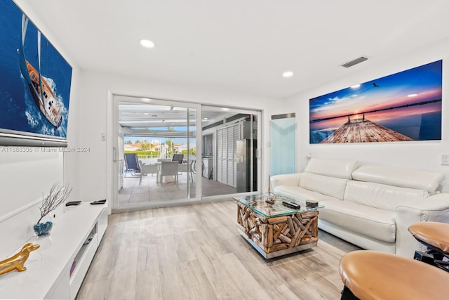 living room with light hardwood / wood-style flooring