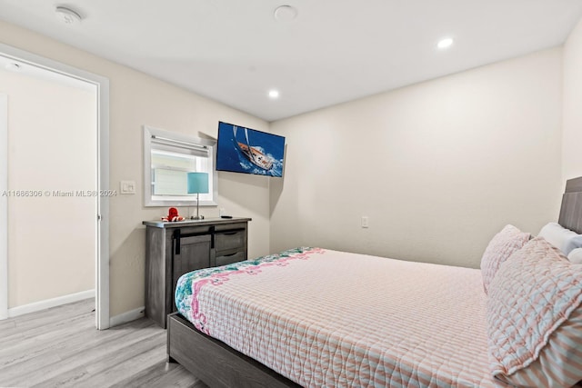 bedroom with light hardwood / wood-style floors