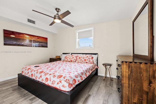 bedroom featuring hardwood / wood-style flooring and ceiling fan