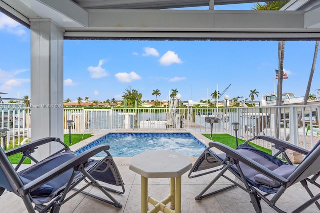 view of swimming pool featuring a water view