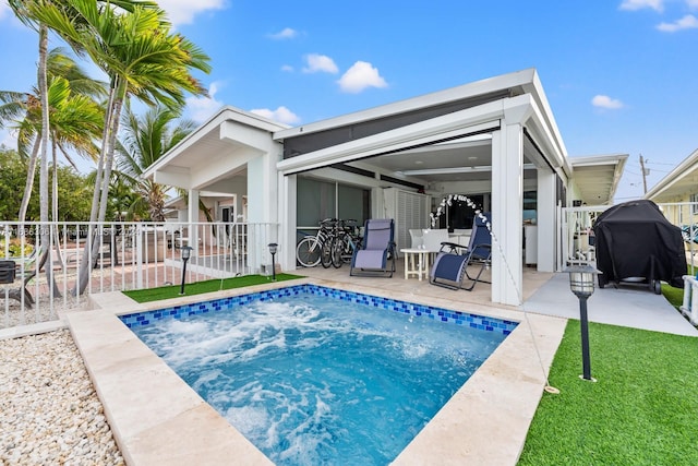 back of house with a patio area and a fenced in pool