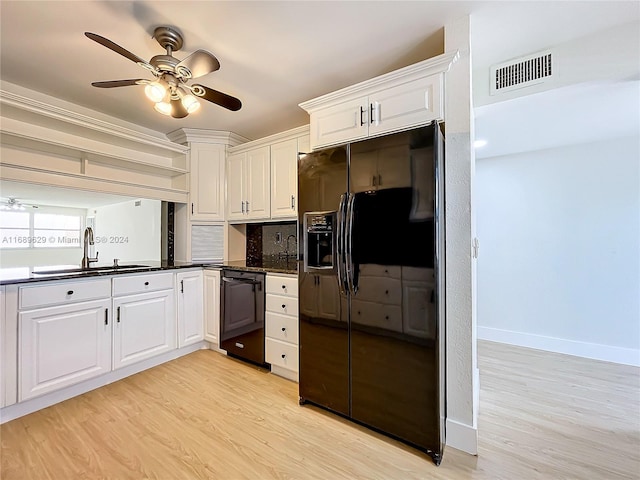 kitchen featuring white cabinetry, sink, ceiling fan, light hardwood / wood-style floors, and black appliances