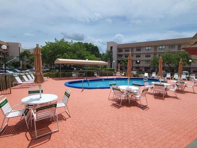 view of swimming pool featuring a patio