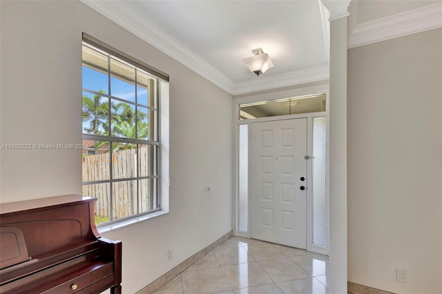 tiled foyer featuring ornamental molding