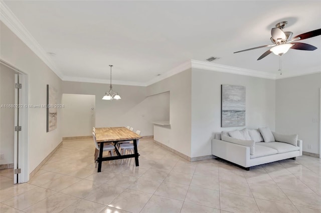 dining room featuring ceiling fan with notable chandelier, light tile patterned flooring, and crown molding