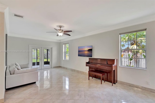 tiled living room with french doors, a healthy amount of sunlight, and crown molding