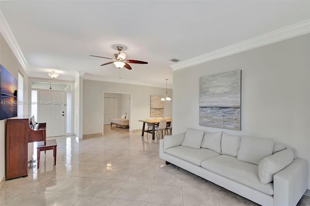 living room with ornamental molding, ceiling fan with notable chandelier, and light tile patterned floors