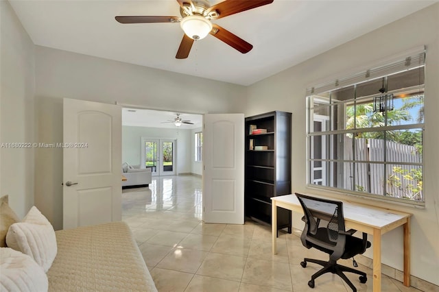 office with french doors, light tile patterned floors, and ceiling fan