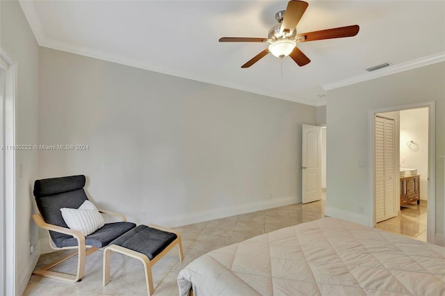 tiled bedroom featuring connected bathroom, ceiling fan, and crown molding