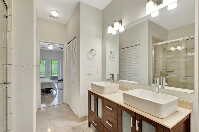 bathroom featuring walk in shower, tile patterned flooring, vanity, and ceiling fan