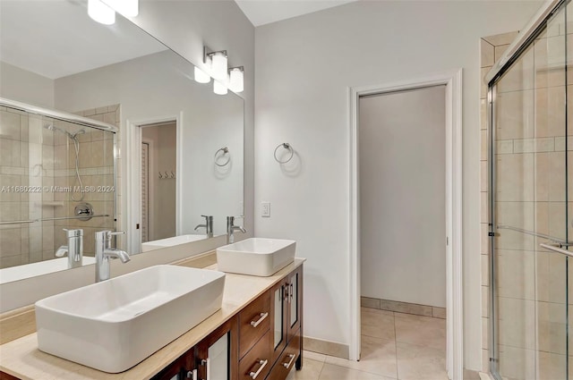 bathroom featuring vanity, walk in shower, and tile patterned floors