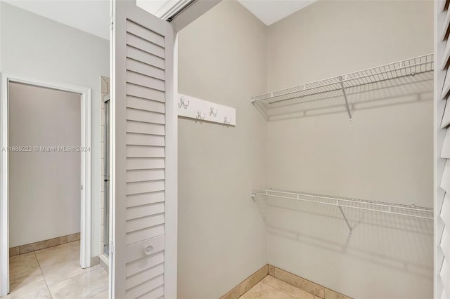 walk in closet featuring light tile patterned floors