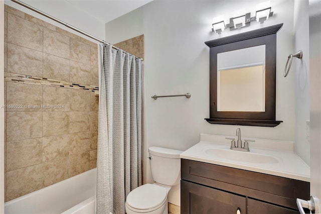 full bathroom with vanity, shower / bath combo with shower curtain, and toilet