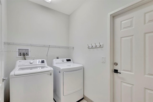 clothes washing area with independent washer and dryer