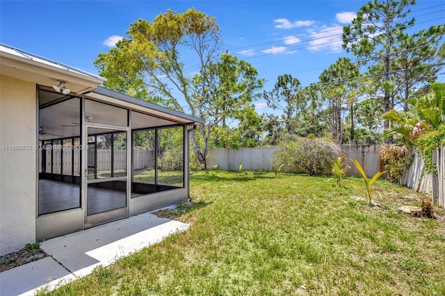 view of yard featuring a sunroom