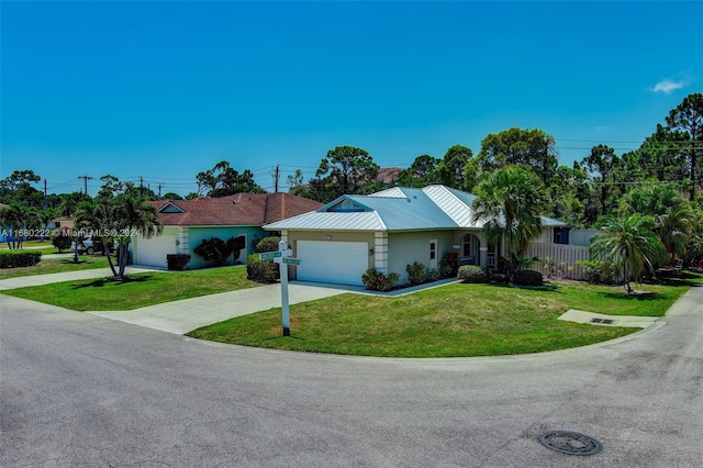 ranch-style home featuring a garage and a front lawn